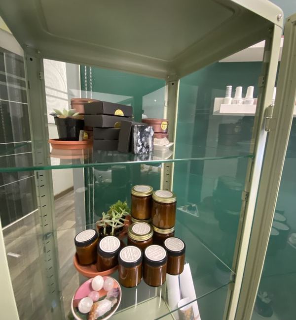 Lotions, butters and scrubs in the studio cabinet